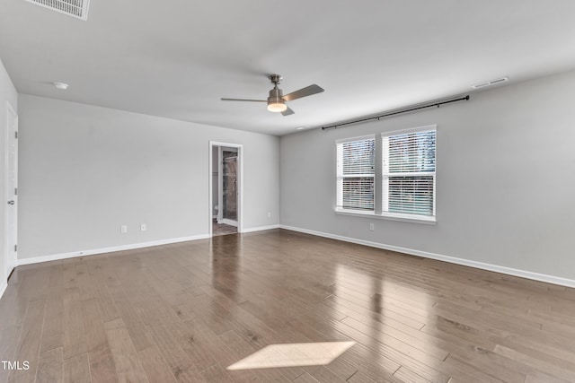 unfurnished room with hardwood / wood-style flooring and ceiling fan