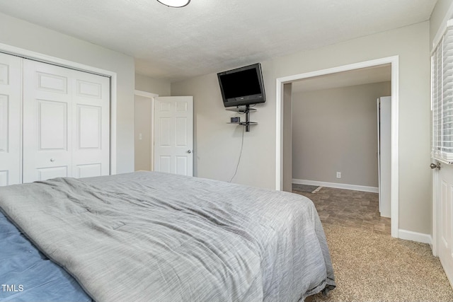 carpeted bedroom featuring a closet