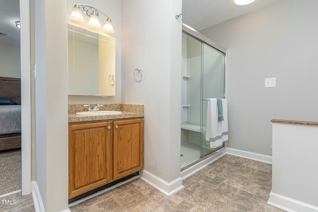 bathroom featuring vanity and an enclosed shower