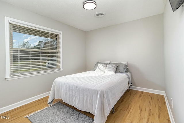 bedroom featuring wood-type flooring