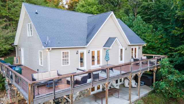 back of house with a wooden deck, a patio area, french doors, and an outdoor hangout area