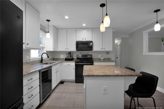 kitchen with white cabinetry, sink, a center island, beverage cooler, and black appliances