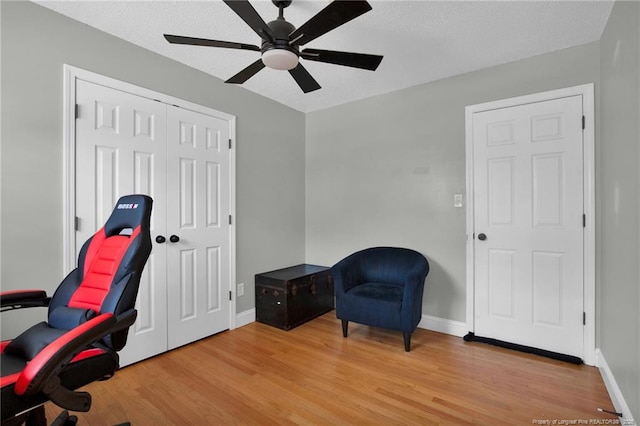 office with hardwood / wood-style flooring, ceiling fan, and a textured ceiling