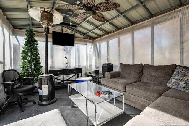 sunroom featuring ceiling fan and lofted ceiling