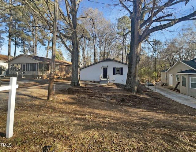 view of yard with a sunroom