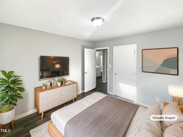 bedroom with dark wood-type flooring