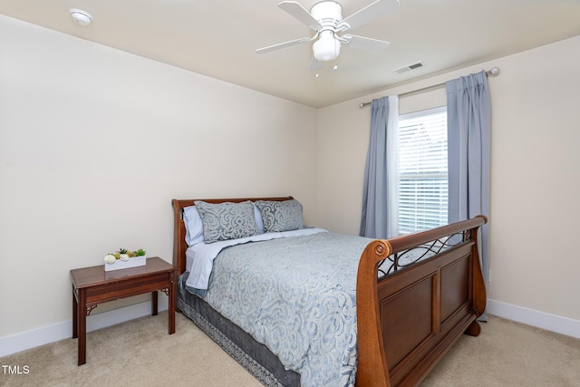 bedroom with light carpet and ceiling fan