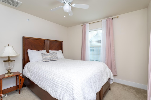 bedroom featuring ceiling fan and light colored carpet