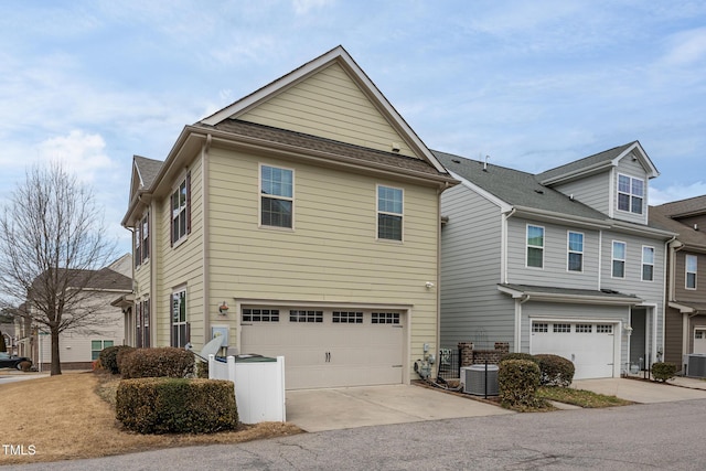 view of property exterior featuring a garage and central air condition unit