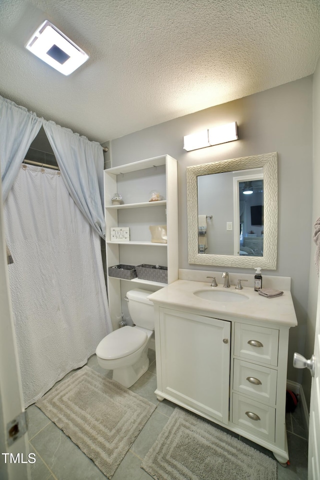 bathroom with curtained shower, vanity, a textured ceiling, and toilet