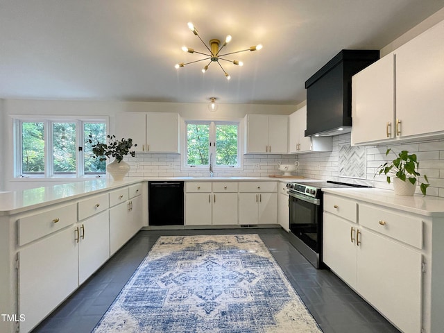 kitchen featuring a wealth of natural light, stainless steel electric stove, dishwasher, and white cabinets