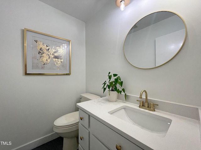 bathroom with toilet and vanity