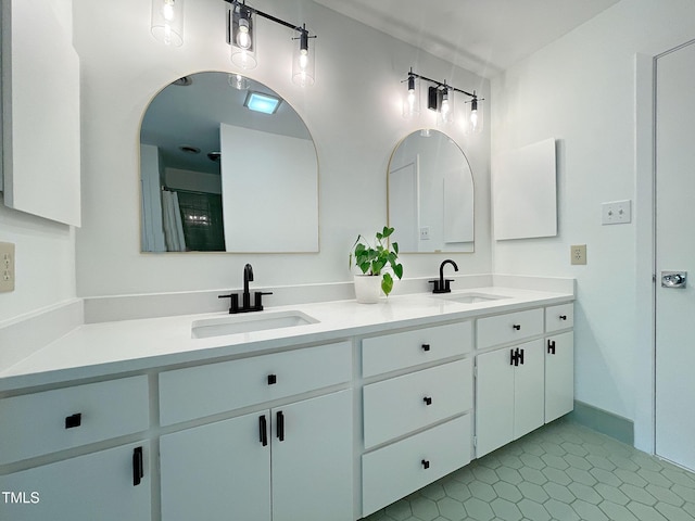 bathroom with vanity and tile patterned flooring