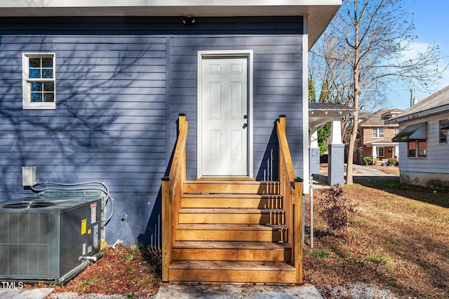 entrance to property featuring central AC unit