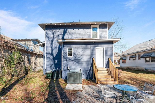 rear view of property with central air condition unit