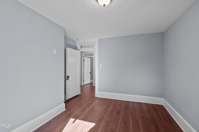 unfurnished room featuring wood-type flooring