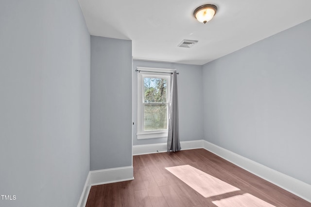 empty room featuring dark hardwood / wood-style floors