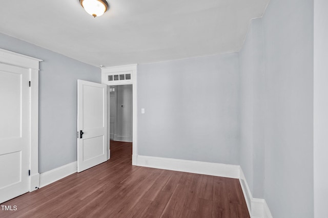 unfurnished room with hardwood / wood-style floors