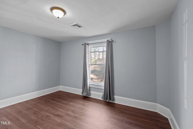 unfurnished room featuring hardwood / wood-style flooring