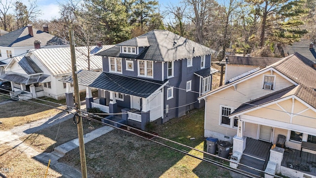 exterior space with central AC and a porch