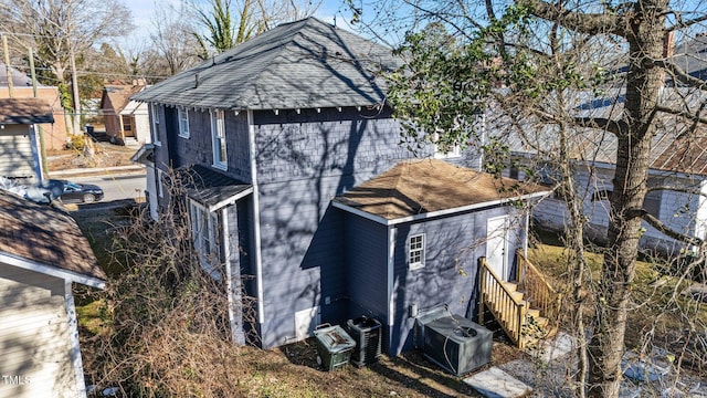 view of side of home with cooling unit