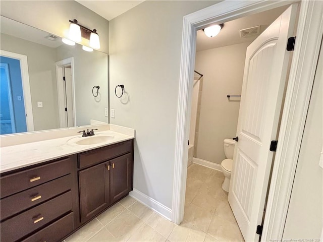 full bathroom with tile patterned floors, vanity, toilet, and shower / tub combination