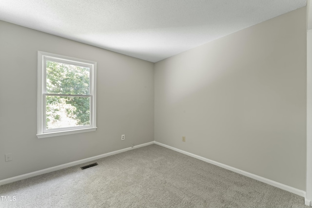 unfurnished room with carpet floors