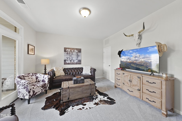 living room featuring light carpet