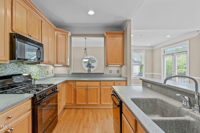 kitchen featuring ornamental molding, sink, black appliances, light brown cabinets, and light hardwood / wood-style floors