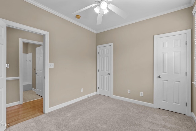 unfurnished bedroom with ceiling fan, light colored carpet, and ornamental molding