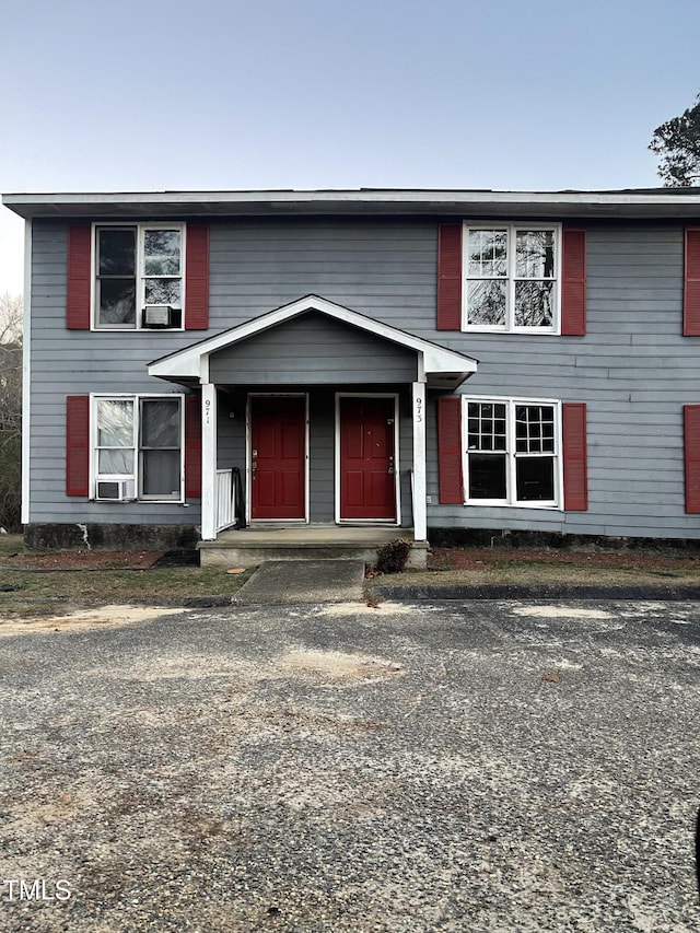 view of front of home featuring cooling unit