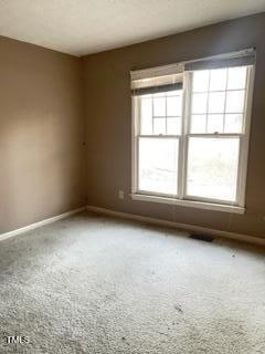 unfurnished room with carpet flooring