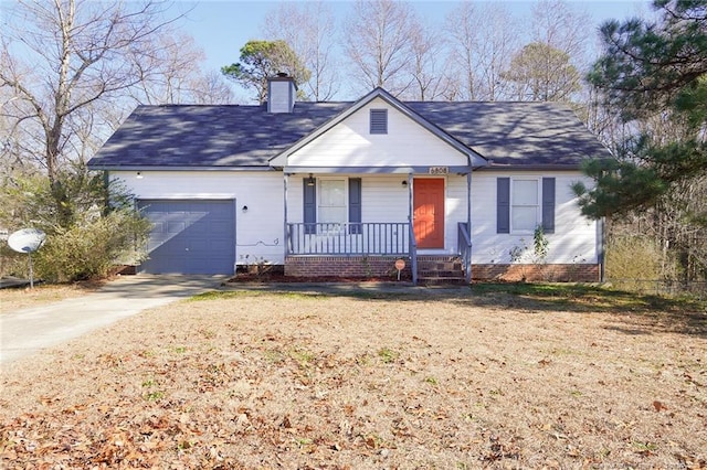 view of front of home with covered porch and a garage