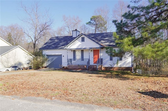 bungalow-style house featuring central AC and a garage