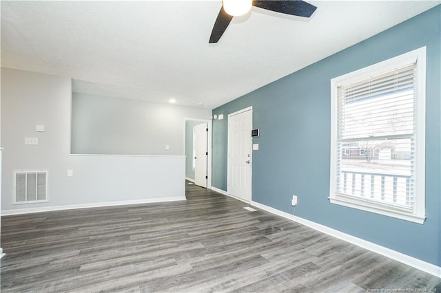 unfurnished room with hardwood / wood-style floors and ceiling fan