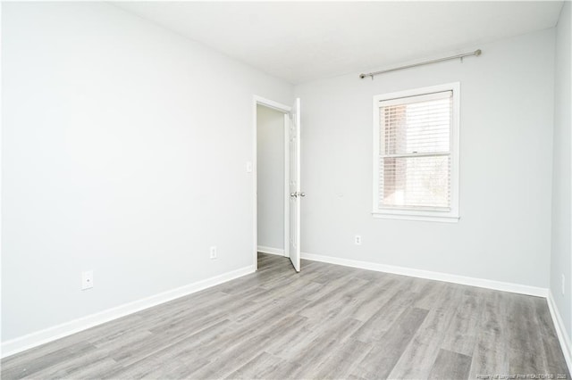 spare room with light wood-type flooring