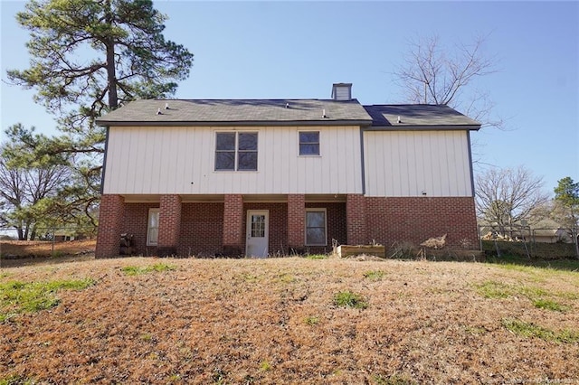 rear view of house with a yard