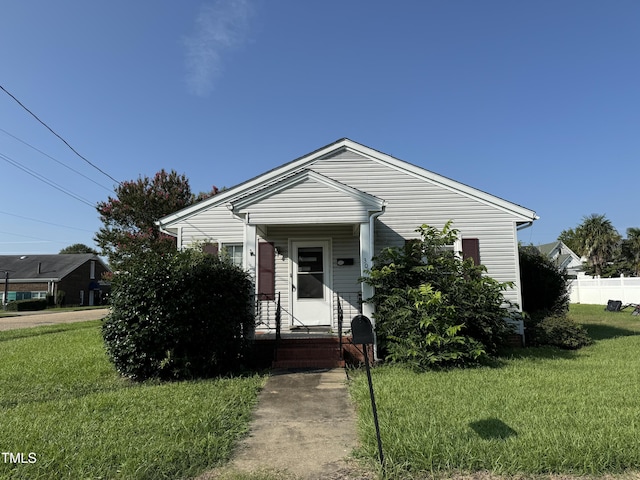 bungalow with a front yard