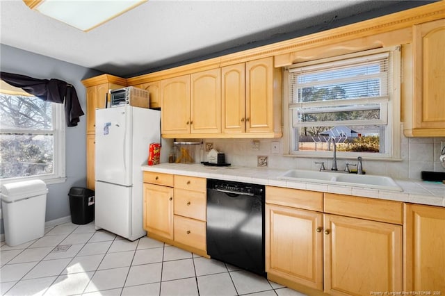 kitchen featuring decorative backsplash, sink, tile countertops, dishwasher, and white fridge