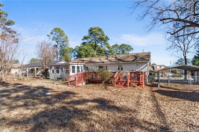 rear view of property featuring a carport