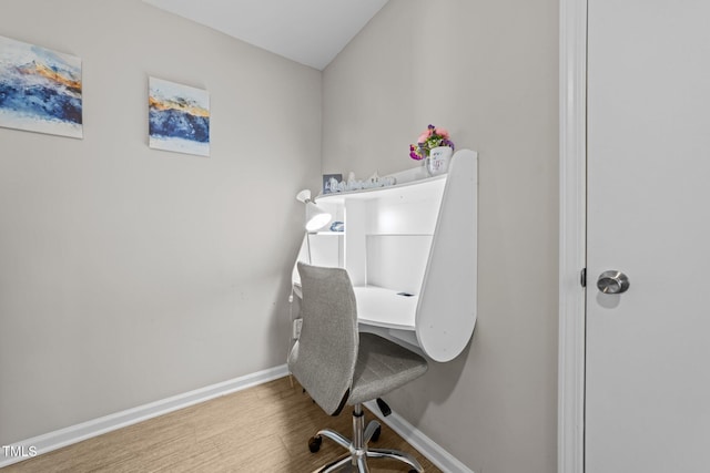 home office with hardwood / wood-style floors