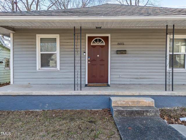 doorway to property with a porch