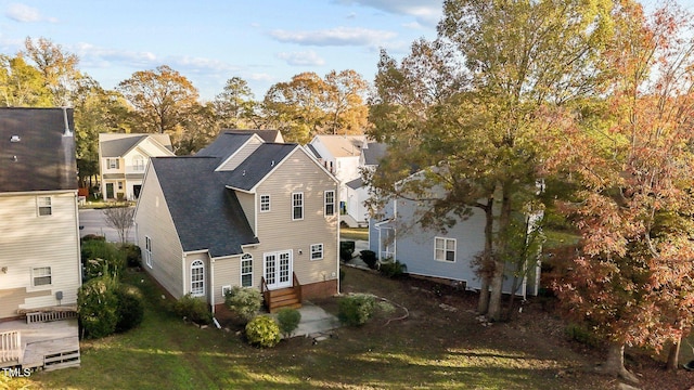 exterior space featuring a yard and french doors