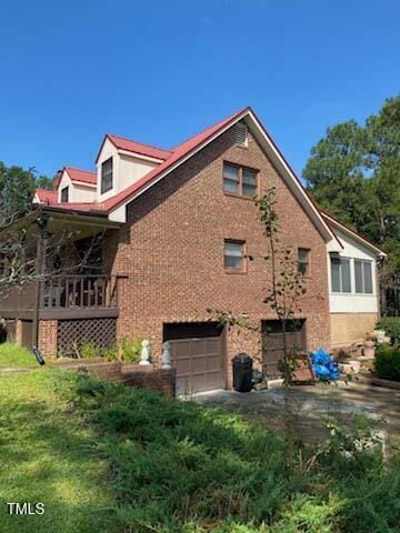 view of property exterior with a garage