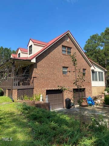 view of home's exterior with a garage