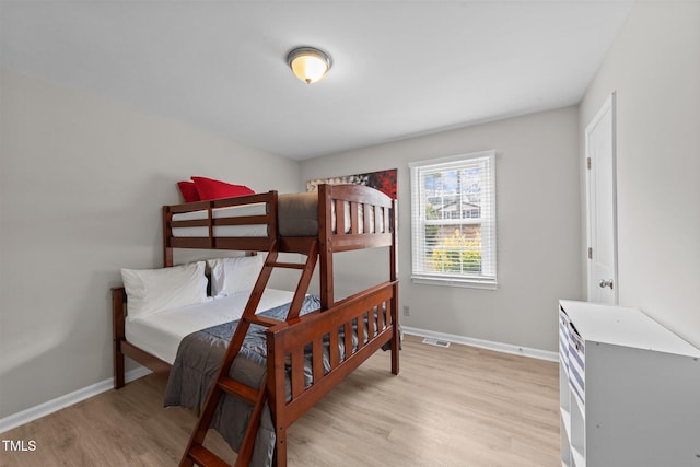 bedroom with light hardwood / wood-style floors