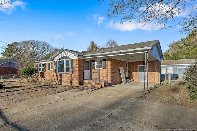 single story home featuring a carport