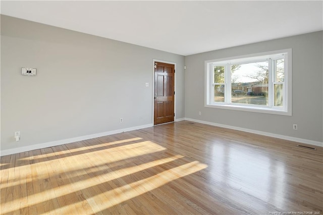 empty room featuring hardwood / wood-style floors