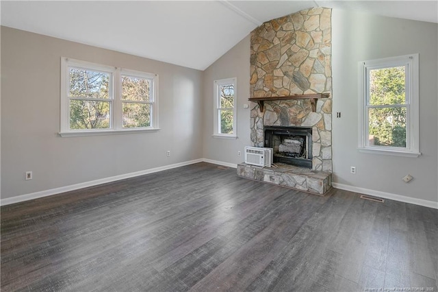 unfurnished living room featuring a fireplace, dark wood-type flooring, and vaulted ceiling