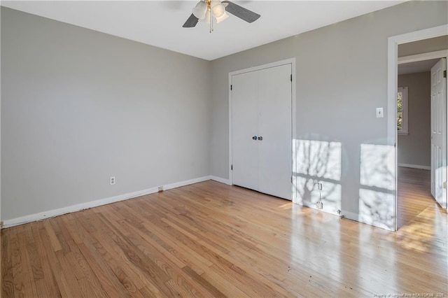 empty room featuring ceiling fan and light wood-type flooring